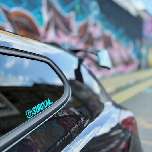Vinyl Instagram Tag Stickers on a car window. Car Instagram Stickers finished In a teal gloss colour