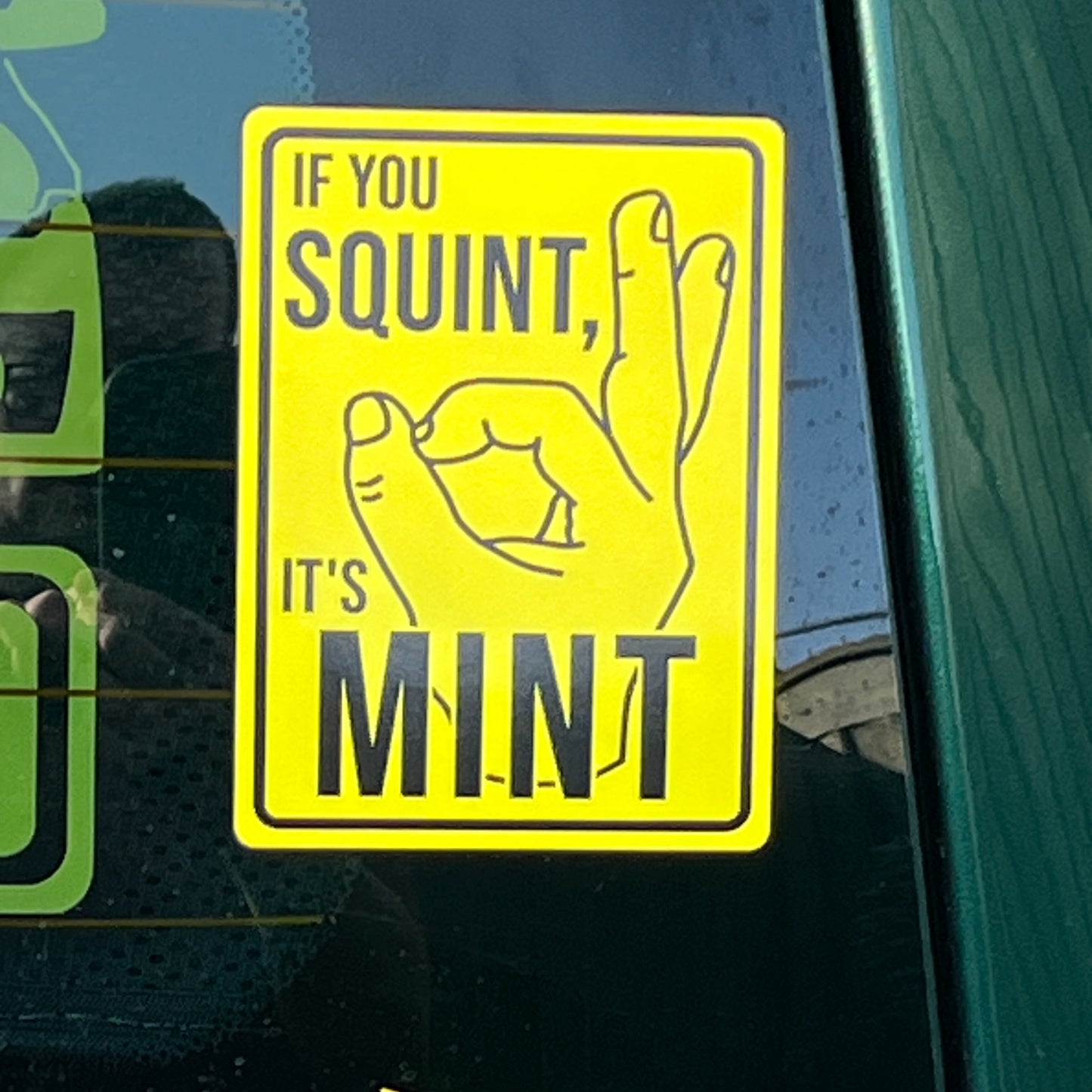 If you squint it’s mint vinyl car sticker placed onto the back window of a van.