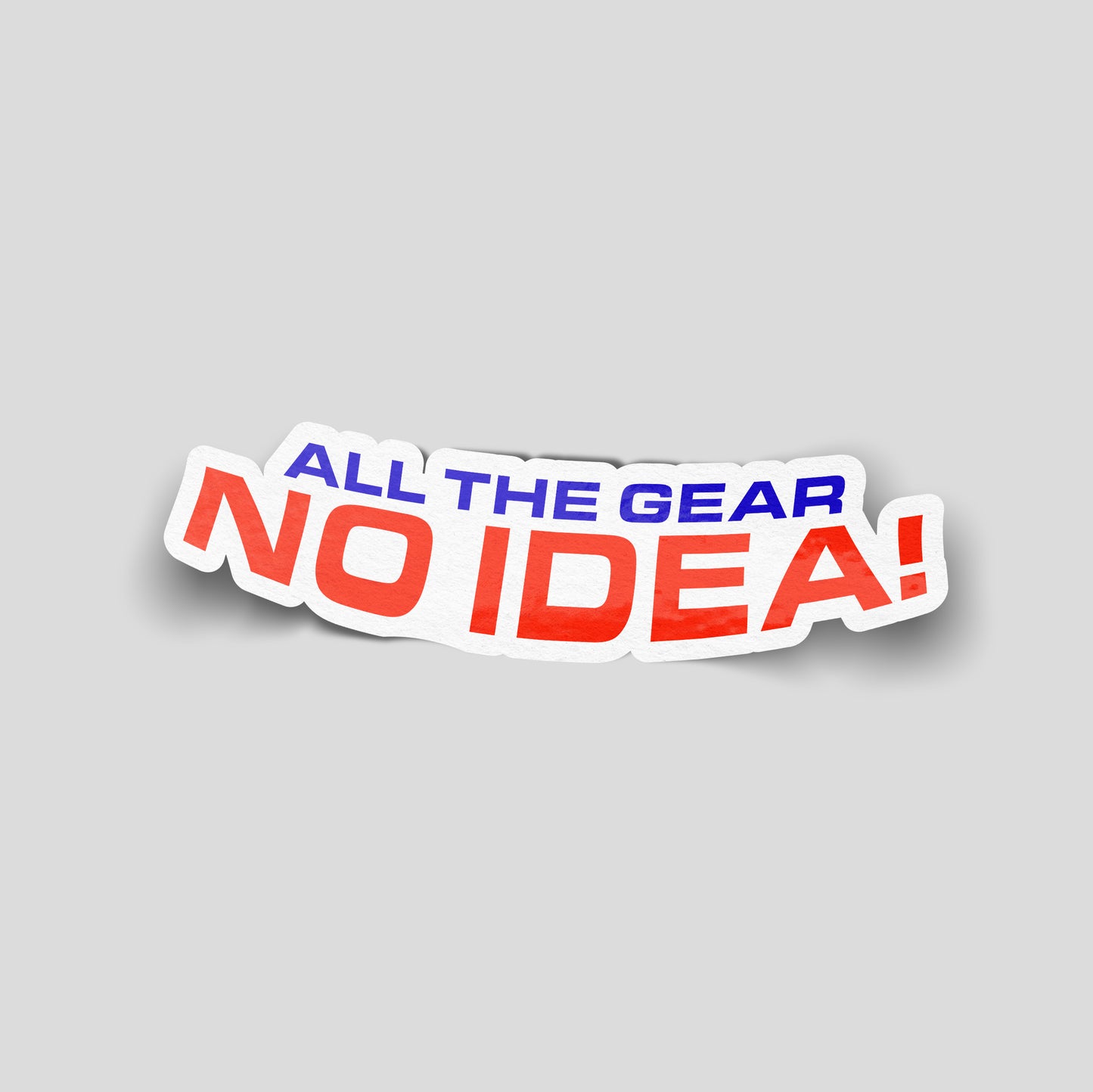Red and blue text reading “All the gear, no idea!” on a curved white background, UK outdoor and motoring funny car sticker.