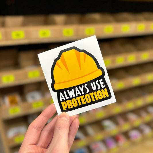 Funny safety helmet sticker with “Always use protection” construction joke design
