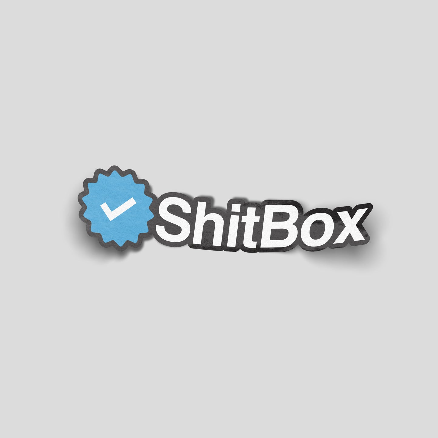 “ShitBox” funny car sticker with a blue verified‑style tick badge, humorous UK car culture decal.