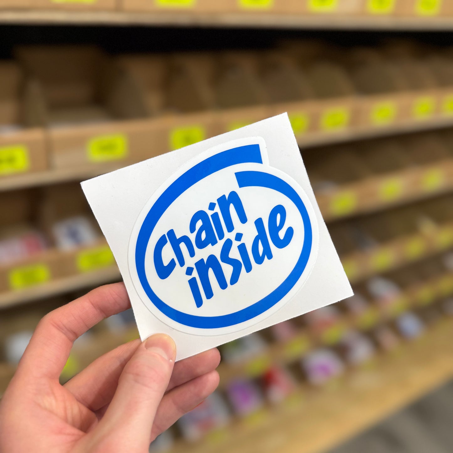 Funny tech parody sticker reading “chain inside” inspired by computer processor logo