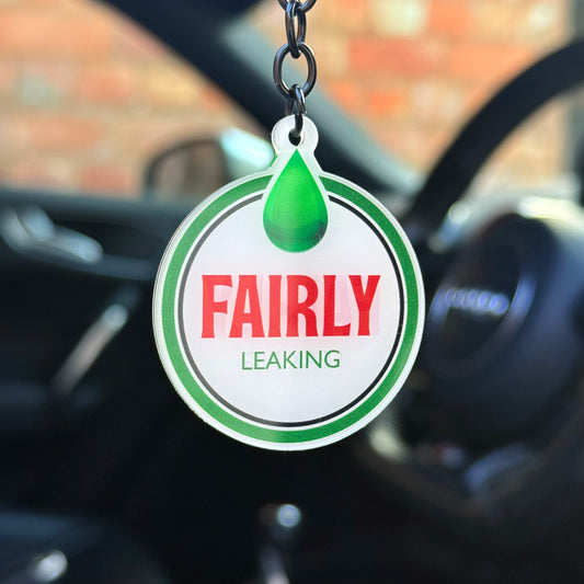 Funny “Fairly leaking” keychain with oil drip design, novelty mechanic humour keyring for car lovers, durable acrylic accessory UK made