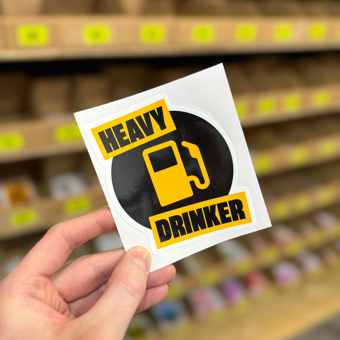 Funny drinking sticker showing fuel pump icon with “heavy drinker” text