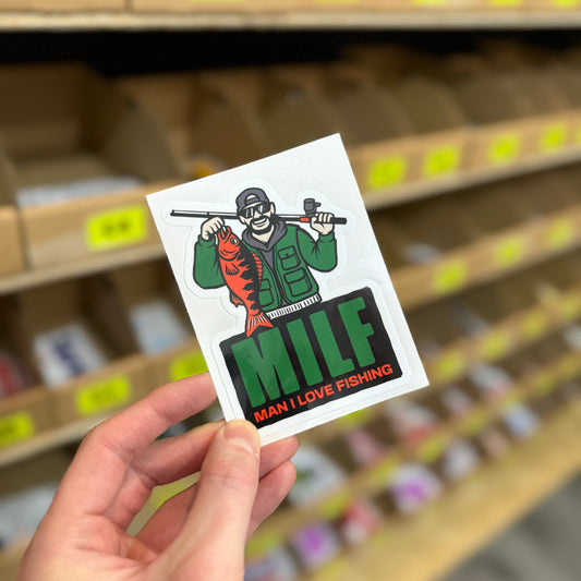 Funny fishing sticker showing angler holding fish with “man I love fishing” text