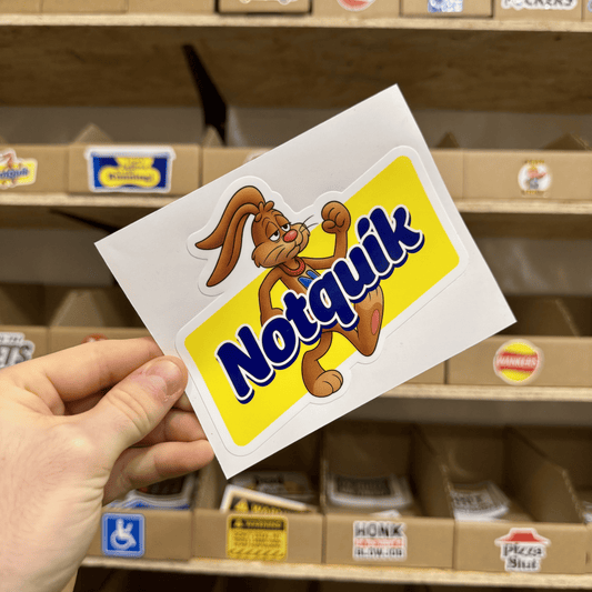 Parody yellow and blue sticker featuring a cartoon rabbit flexing next to the text ‘Notquik.