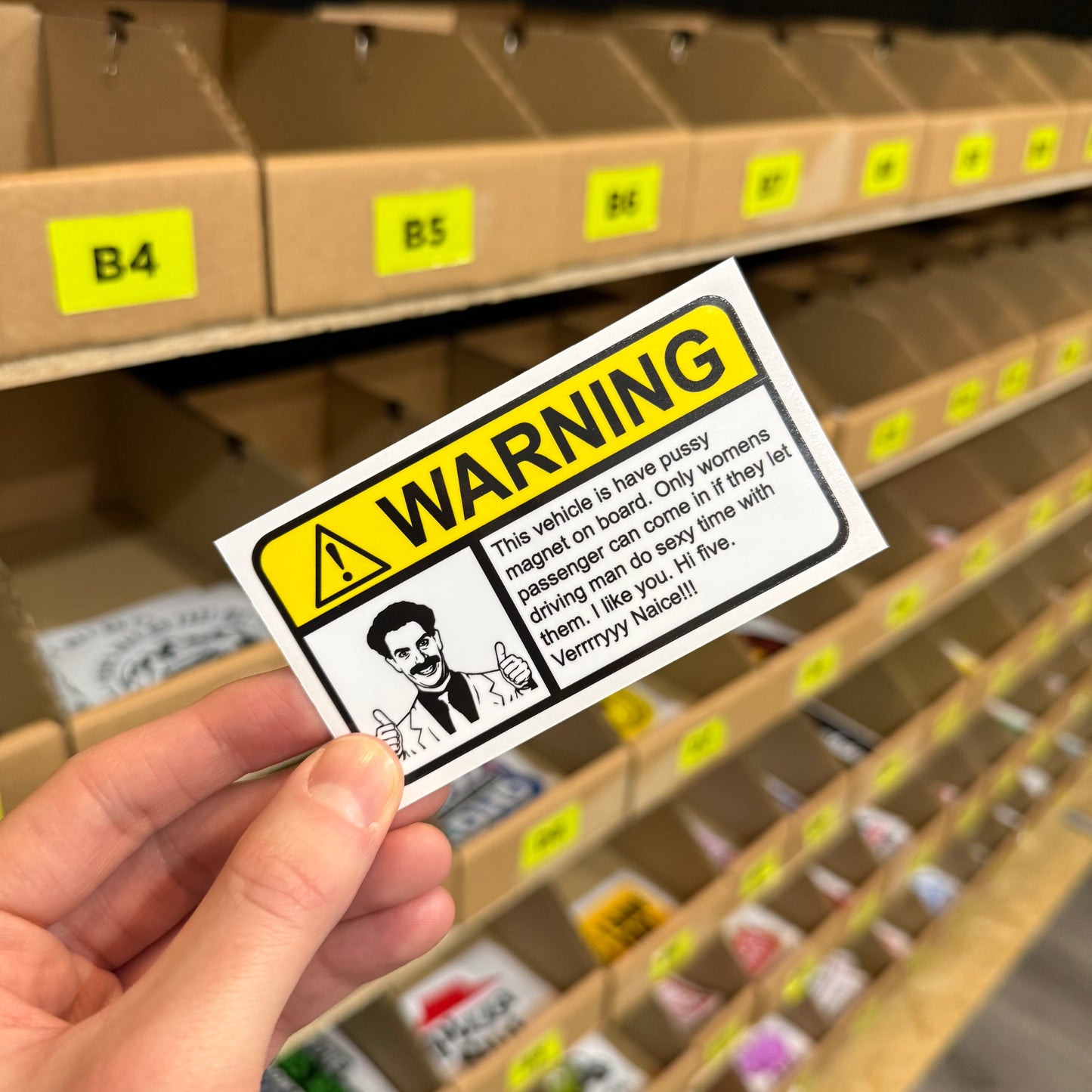 Funny rude car sticker reading “pussy magnet” bold novelty vinyl design