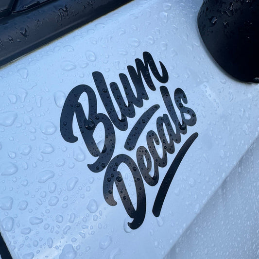 Waterproof laminated vinyl sticker fitted outdoors to a vehicle by Blum Decals UK