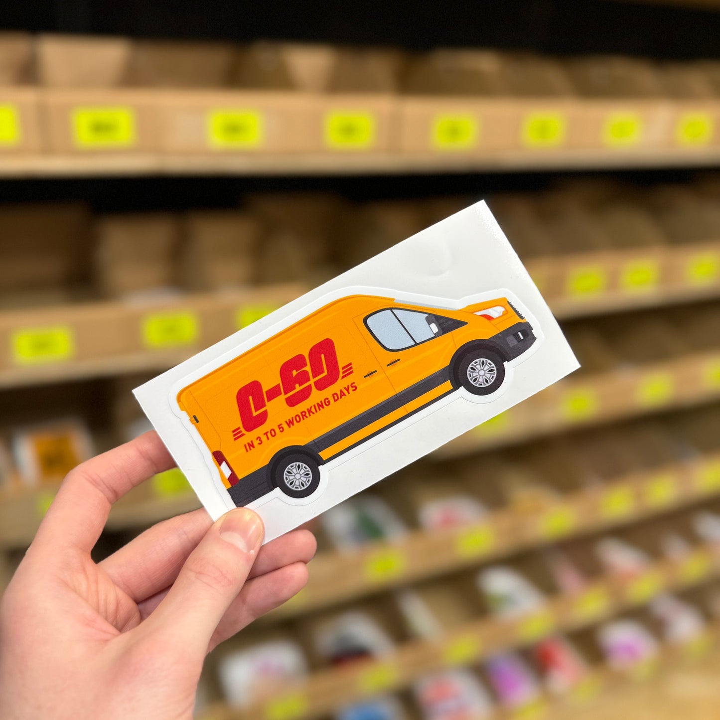 Funny delivery van sticker parody showing yellow courier van with “0–60 in 3 to 5 working days” text