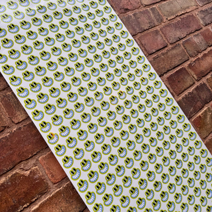 3cm bulk custom vinyl sticker sheet filled with repeated contour-cut logo stickers, printed on waterproof gloss laminated vinyl in the UK.