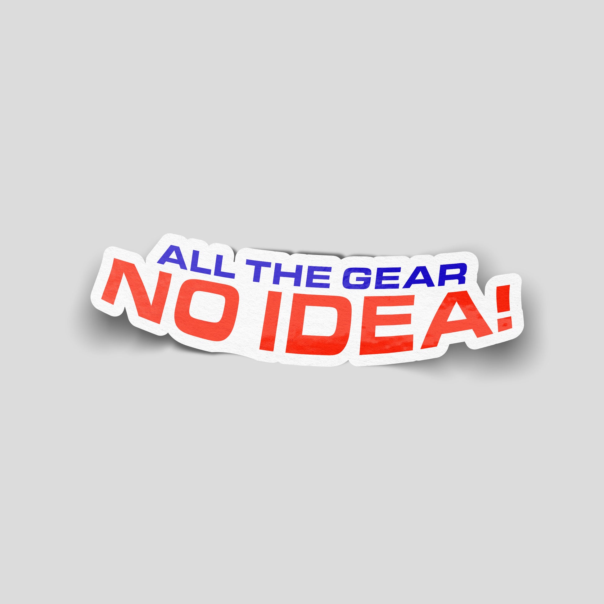 Red and blue text reading “All the gear, no idea!” on a curved white background, UK outdoor and motoring funny car sticker.