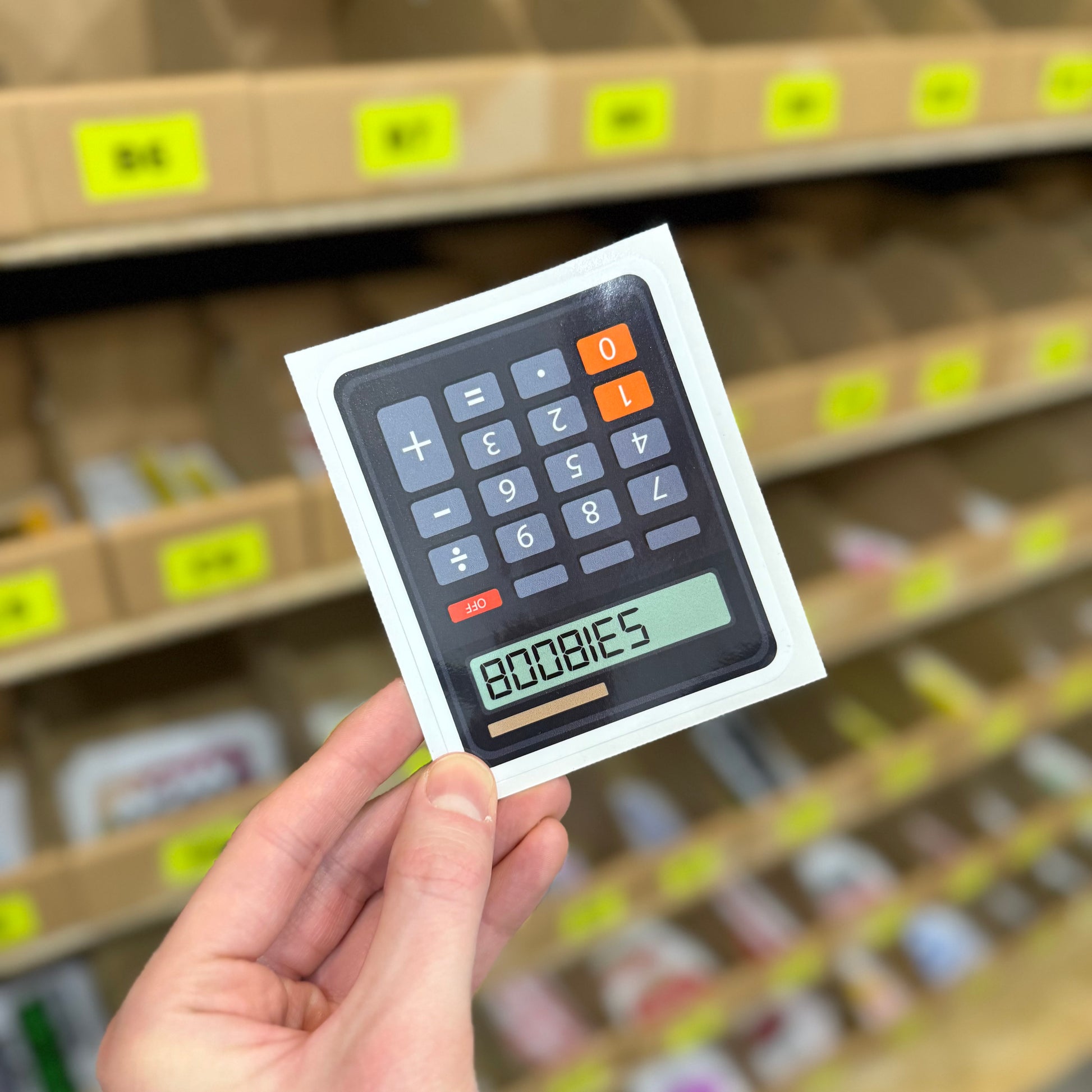 Funny calculator sticker displaying the word “boobies” on digital screen novelty vinyl decal