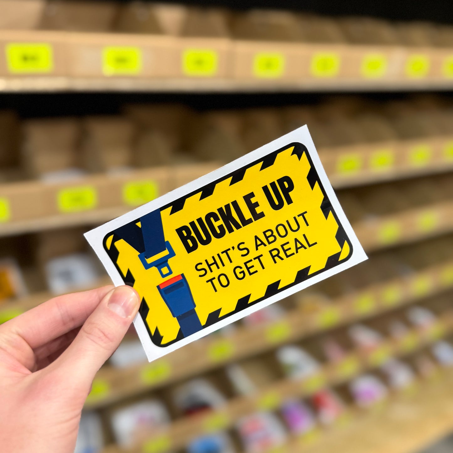 Funny warning sticker reading “buckle up shit’s about to get real” novelty decal