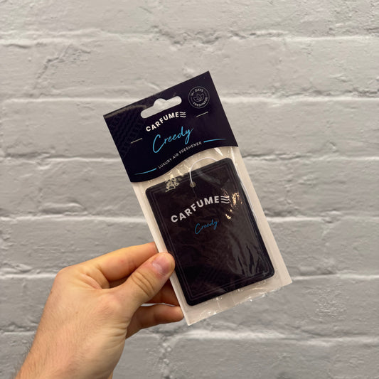 Carfume Creedy luxury hanging car air freshener in black and blue packaging, featuring an aftershave-inspired fragrance.