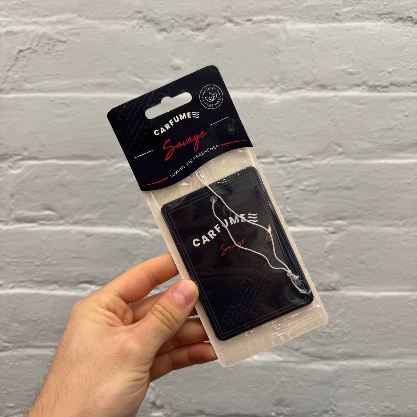 Carfume Savage luxury hanging car air freshener in black and red packaging, with an aftershave-inspired fragrance.