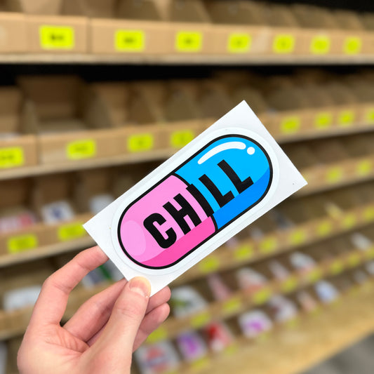 Funny slang sticker showing colourful capsule pill with “chill” text