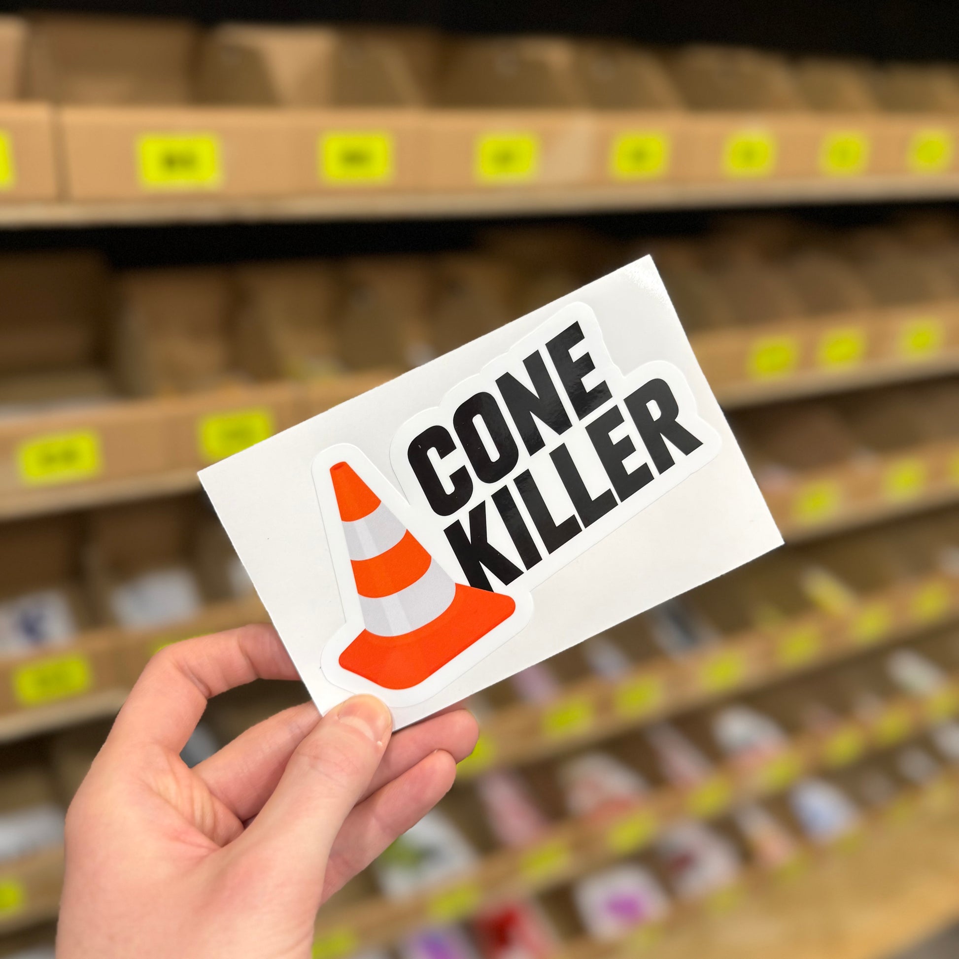 Funny car sticker showing traffic cone graphic with “cone killer” text