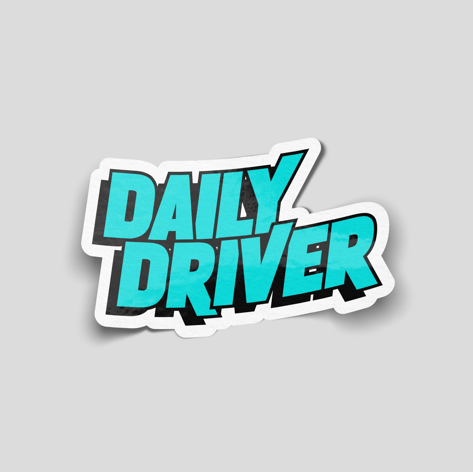 Large turquoise block text reading “Daily Driver” with black shadowing, minimalist funny car sticker for UK car enthusiasts.