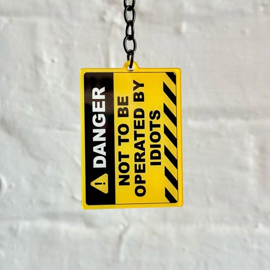Danger not to be operated by idiots funny warning sign acrylic keychain with black chain
