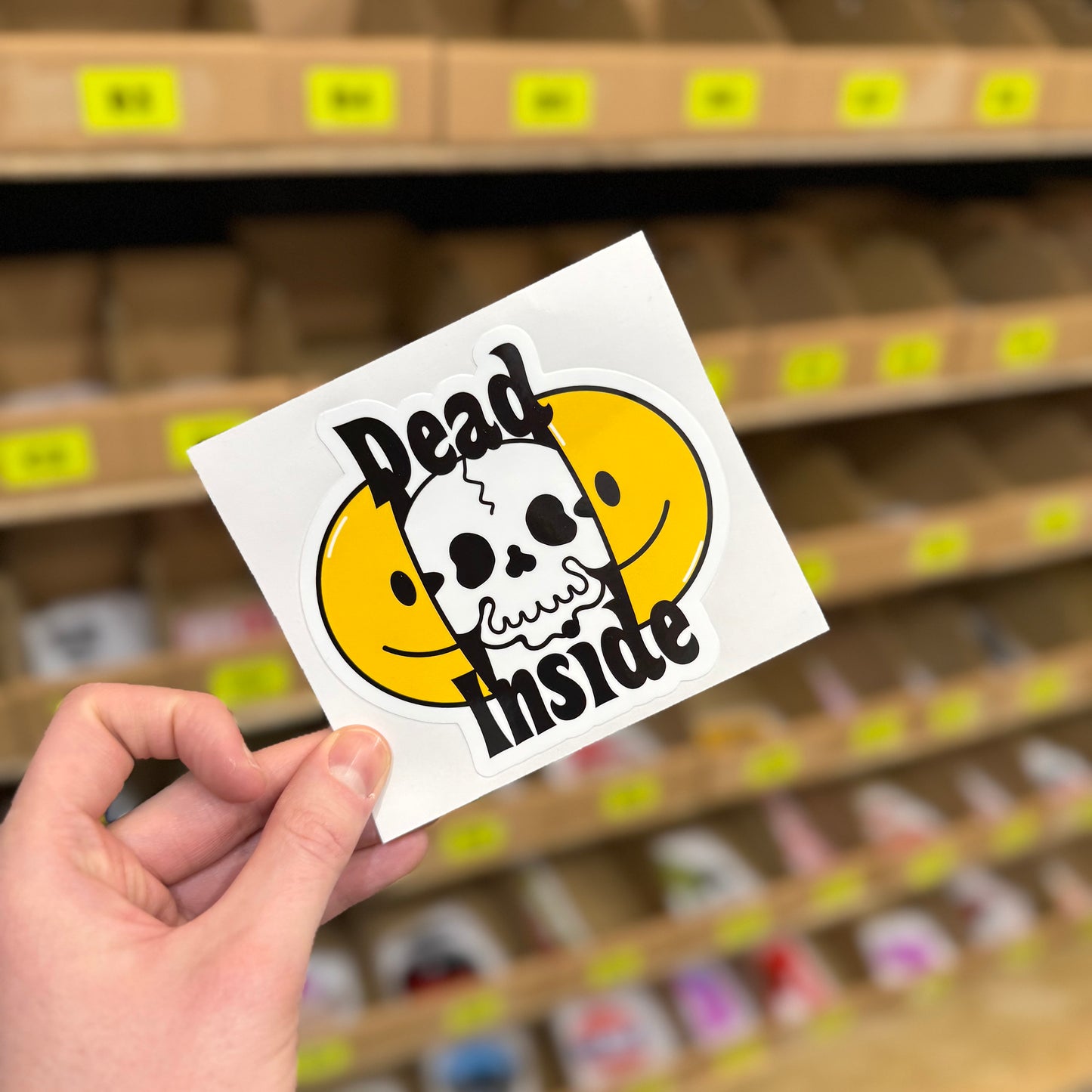 Funny skull sticker reading “dead inside” with smiley face graphic