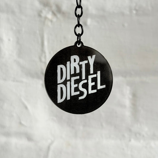 Funny “Dirty Diesel” acrylic keychain with bold black and white design, glossy double-sided print and black chain, ideal for diesel car and truck owners.