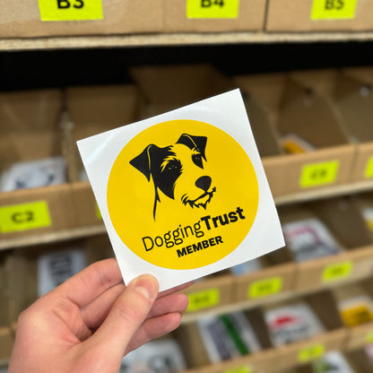 Funny parody sticker reading “dogging trust member” with dog illustration