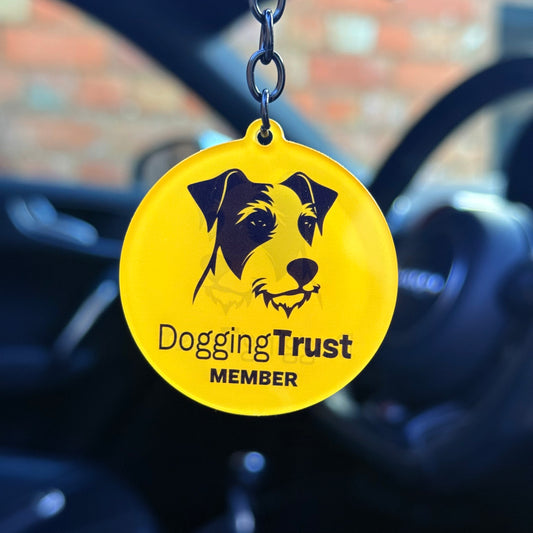 Funny “Dogging Trust Member” keychain with dog graphic, cheeky novelty keyring for car owners, bold acrylic design made in the UK