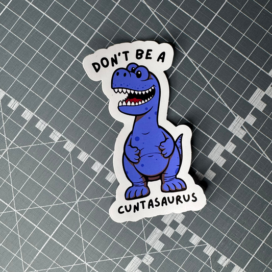 Funny "Don't Be A Cuntasaurus" sticker featuring a blue dinosaur.