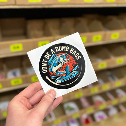 Funny fishing sticker reading “don’t be a dumb bass” with illustrated fish design