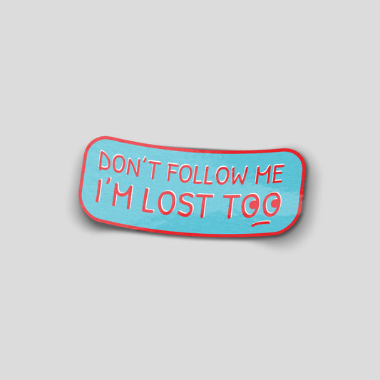 Blue and red “Don’t follow me, I’m lost too” funny car sticker with curved text, humorous UK motoring decal.