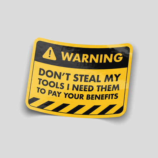 Yellow and black warning‑style funny car sticker reading “Don’t steal my tools, I need them to pay your benefits”, UK tradesperson humour decal.