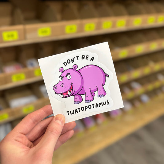 Funny rude sticker showing cartoon hippo with “don’t be a twatopotamus” text