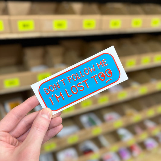 Funny slogan sticker reading “don’t follow me I’m lost too” novelty vinyl design