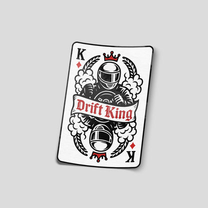 Illustrated Drift King funny car sticker designed like a playing card with a helmeted driver and smoke graphics, UK drifting humour decal.