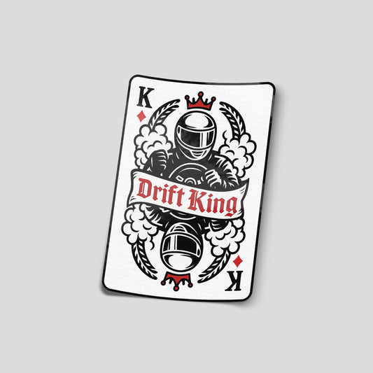 Illustrated Drift King funny car sticker designed like a playing card with a helmeted driver and smoke graphics, UK drifting humour decal.