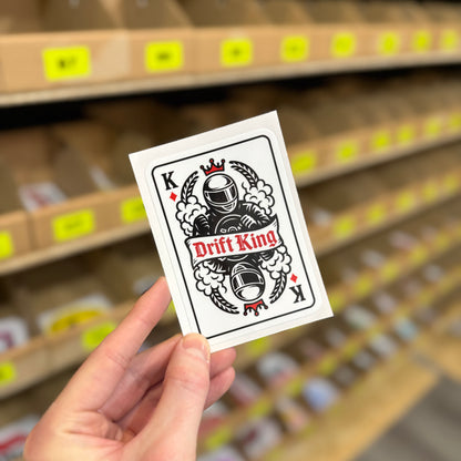 Funny drift car sticker featuring playing card design with helmeted driver and “drift king” text