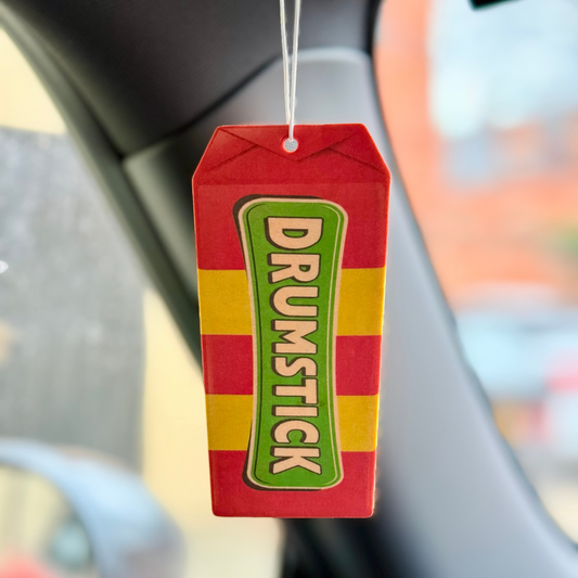 Official Swizzels Drumstick Car Air Freshener – Raspberry & Milk Scent. Fun, nostalgic fragrance in a vibrant, hanging air freshener design. Perfect for cars, vans, and home use.