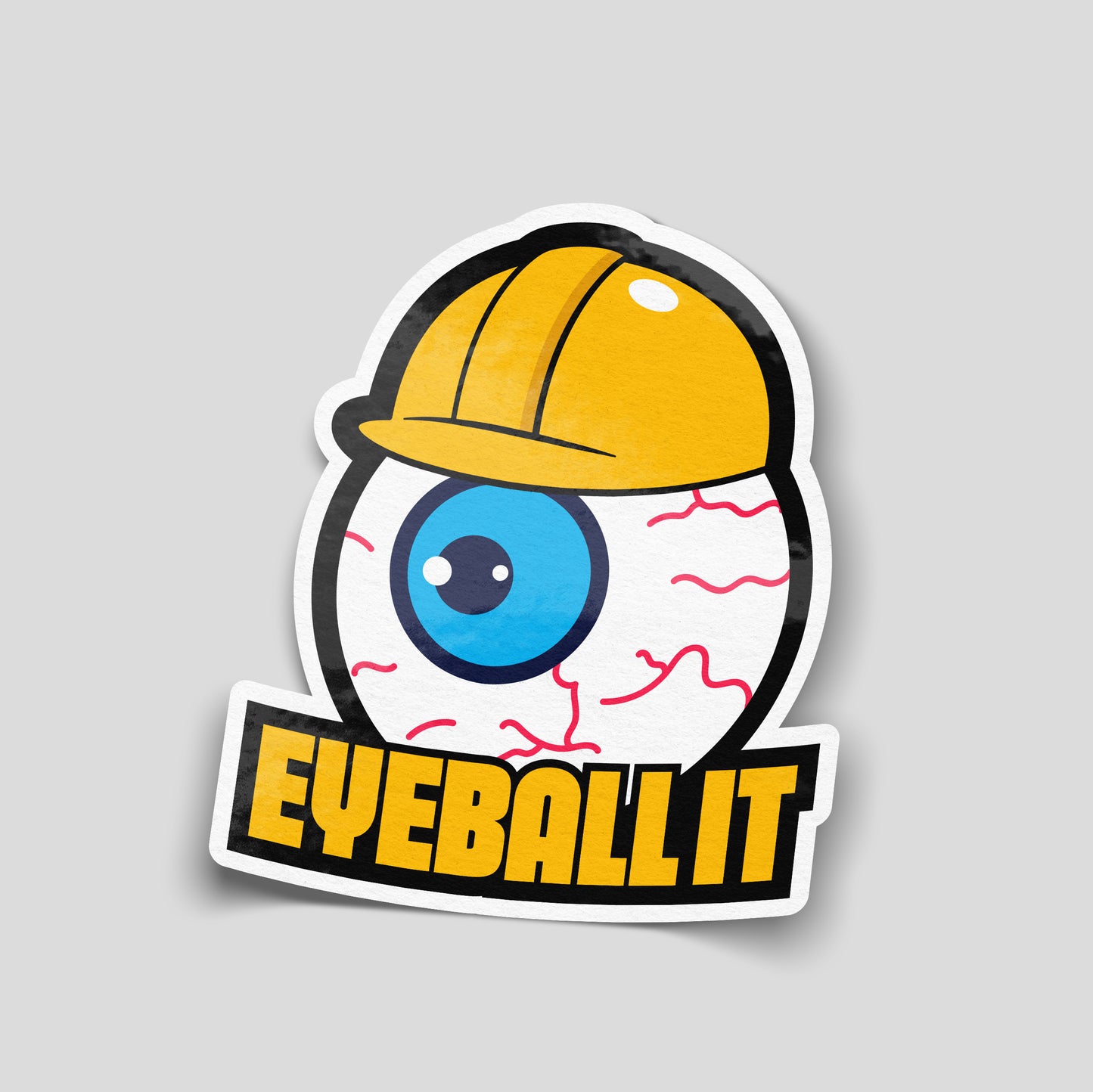 Funny eyeball it vinyl sticker with cartoon eyeball wearing hard hat, novelty trade humour decal for workshops and toolboxes.