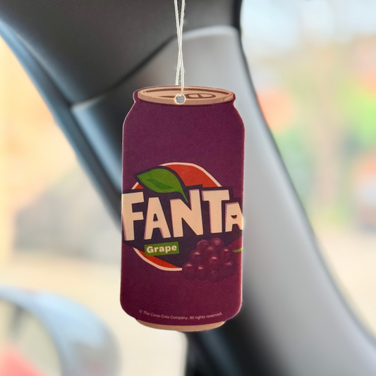 Fanta grape design air freshener hanging in a car with the iconic Fanta can design