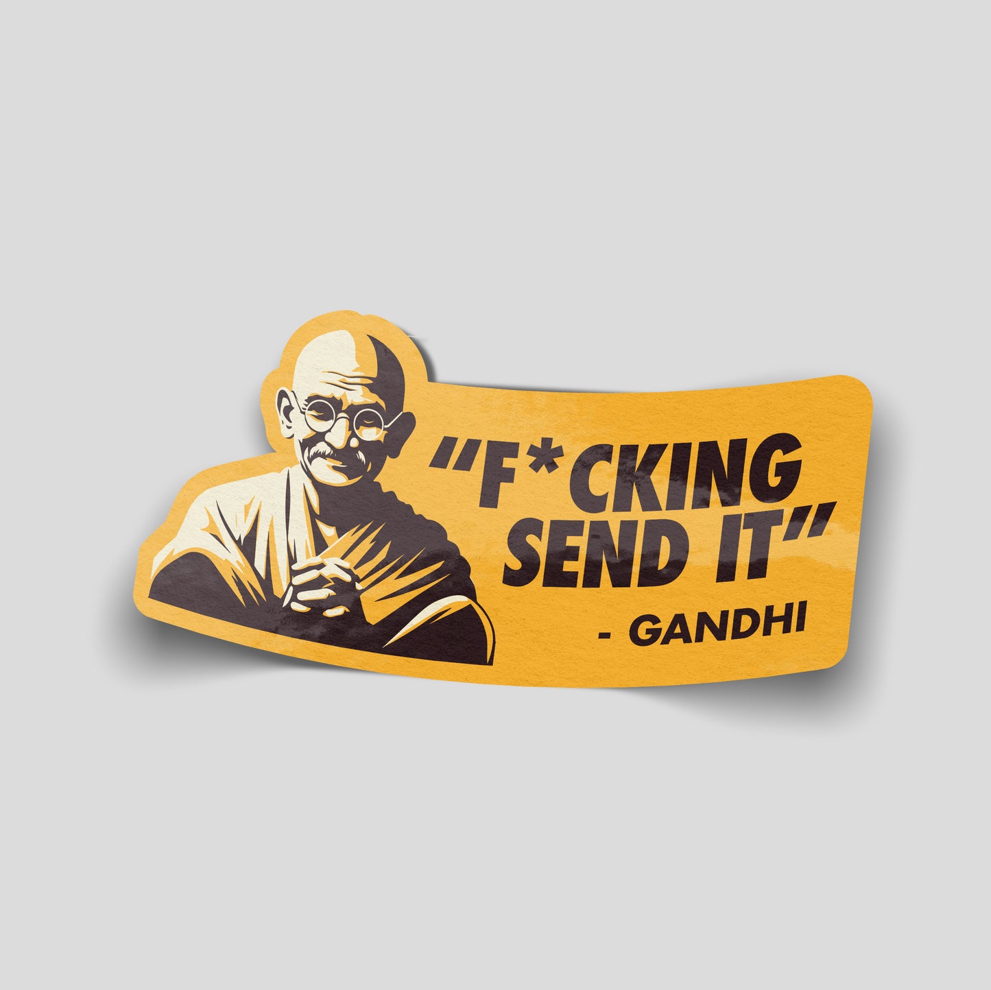 Gold‑tone funny car sticker featuring an illustrated Gandhi with the caption “Fcking Send It”, bold UK meme humour decal.