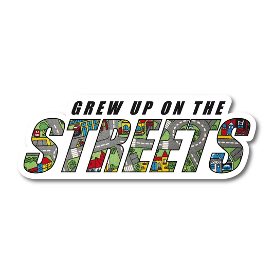 Funny vinyl sticker reading “Grew Up on the Streets” with childhood road mat design inside the lettering – nostalgic decal for cars and toolboxes.

