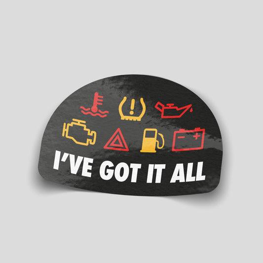 Funny car sticker featuring dashboard warning lights above the text “I’ve got it all”, humorous UK motoring decal.