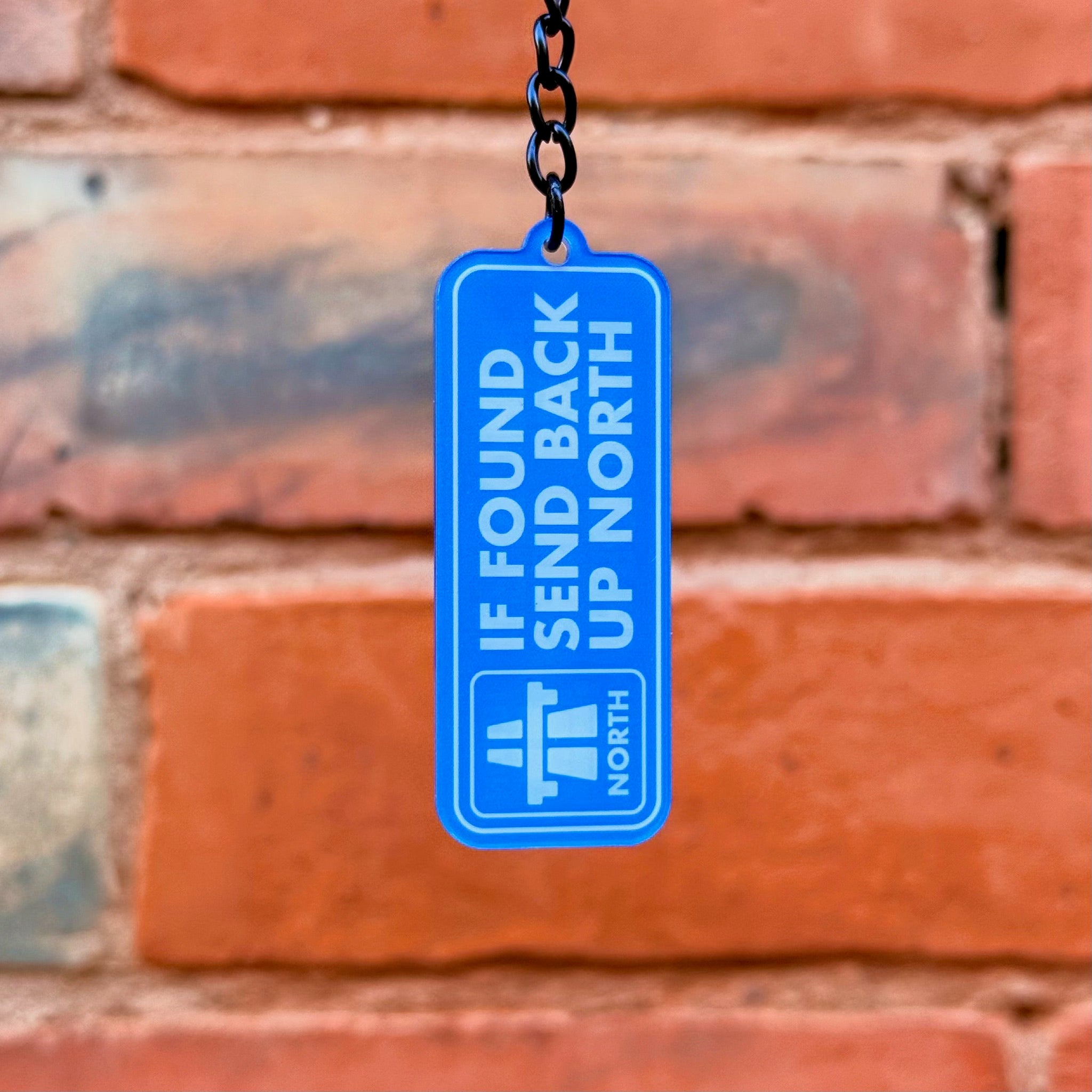 If Found Send Back Up North funny acrylic keychain with gloss black chain and double-sided print