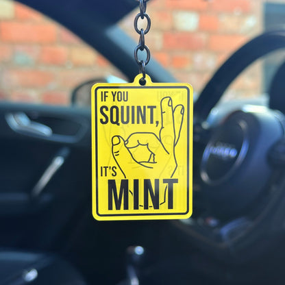 Funny “If you squint, it’s mint” keychain with bold yellow sign design, novelty car humour keyring for modified cars and projects, UK made acrylic