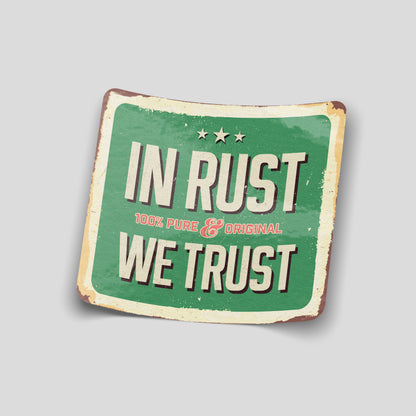 Vintage‑style green “In Rust We Trust” funny car sticker with distressed edges, UK classic car humour decal.