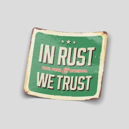 Vintage‑style green “In Rust We Trust” funny car sticker with distressed edges, UK classic car humour decal.
