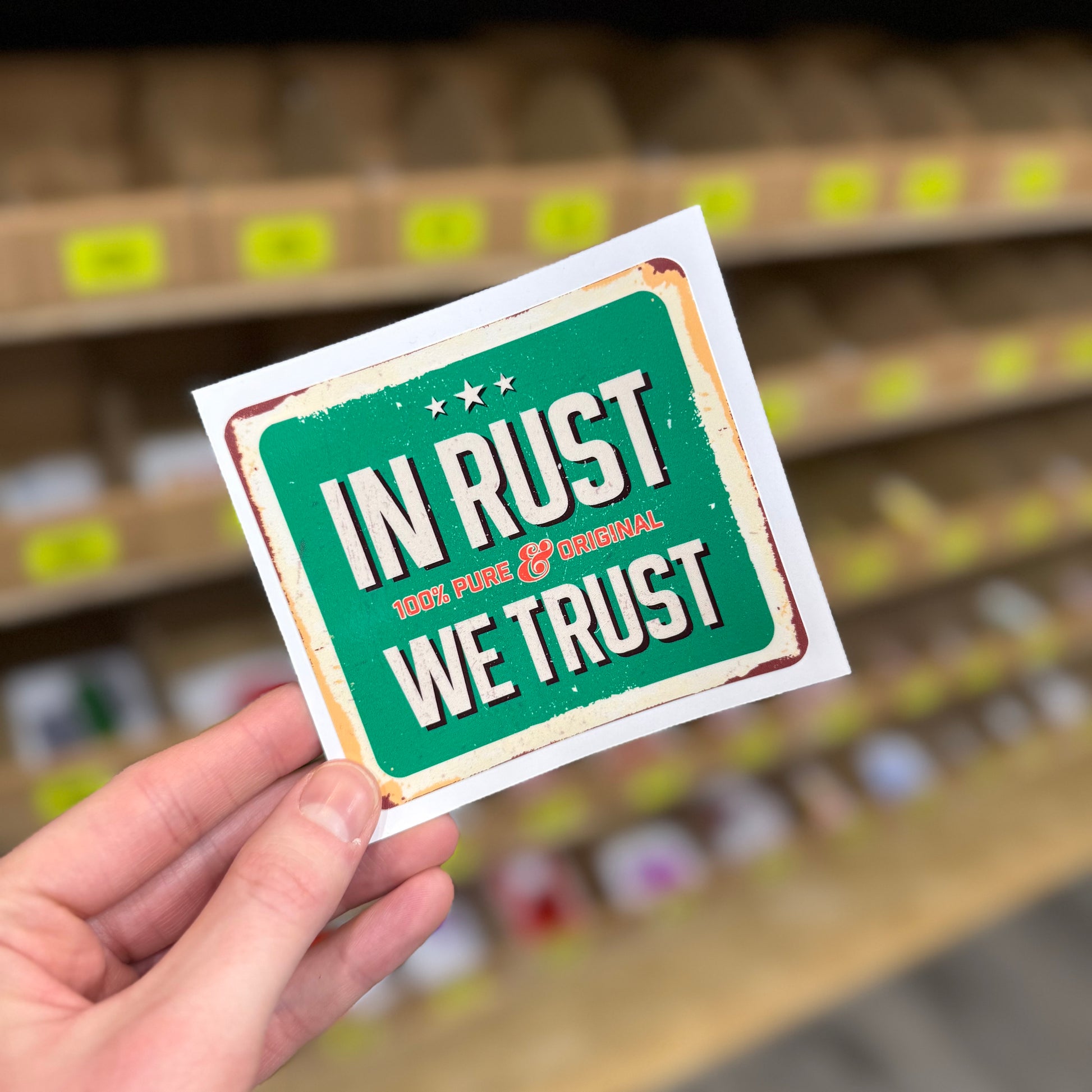 Funny car enthusiast sticker reading “in rust we trust” vintage metal sign style