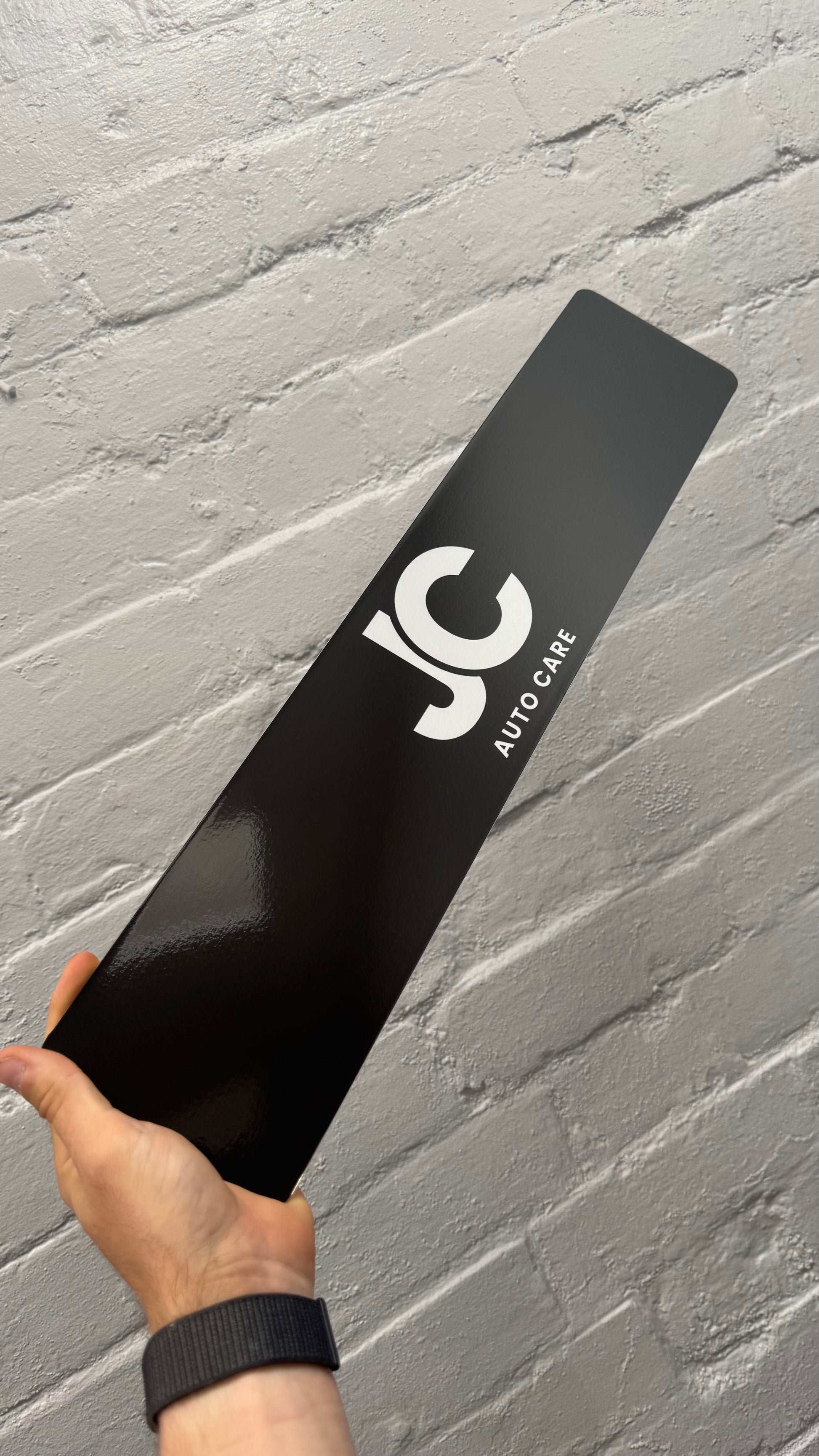 Black personalised car show plate featuring JC Auto Care logo, custom business show plate printed in the UK
