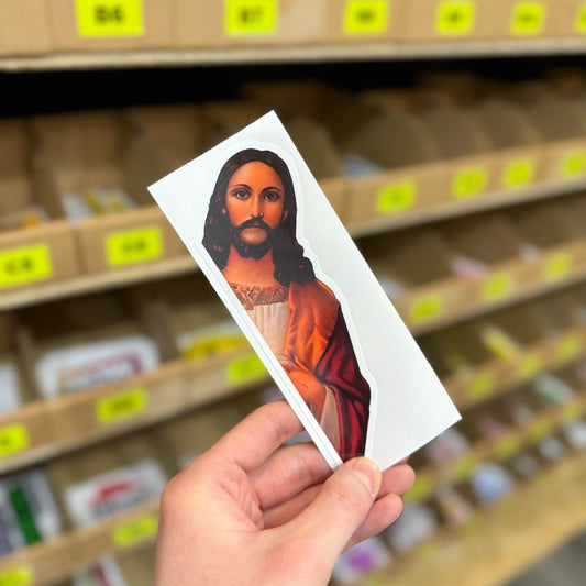 Funny religious parody sticker showing Jesus peeking over edge with serious expression