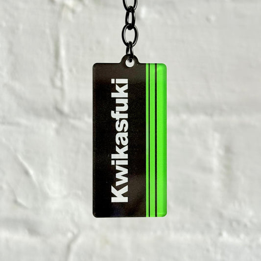 Funny “Kwikasfuki” style acrylic keychain with black and neon green design, glossy double-sided print, durable car keyring for modified car owners.